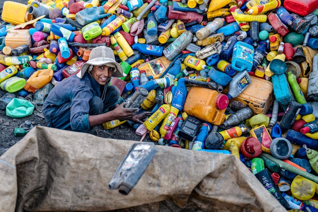 An Afghan worker sorts recyclable plastic cans at a recycling yard on the outskirts of Kabul, on Aug. 5, 2025. (Wakil Kohsar/AFP via Getty Images)