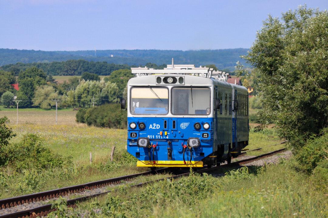 A driverless train of the AZD company named Edita takes passengers for a ride near Kopidlno, Czech Republic, on Aug. 5, 2025. Since April, the train has been running on a local railway used as a testing track by the private company producing transport control and signalling systems. (Jan Flemr/AFP via Getty Images)
