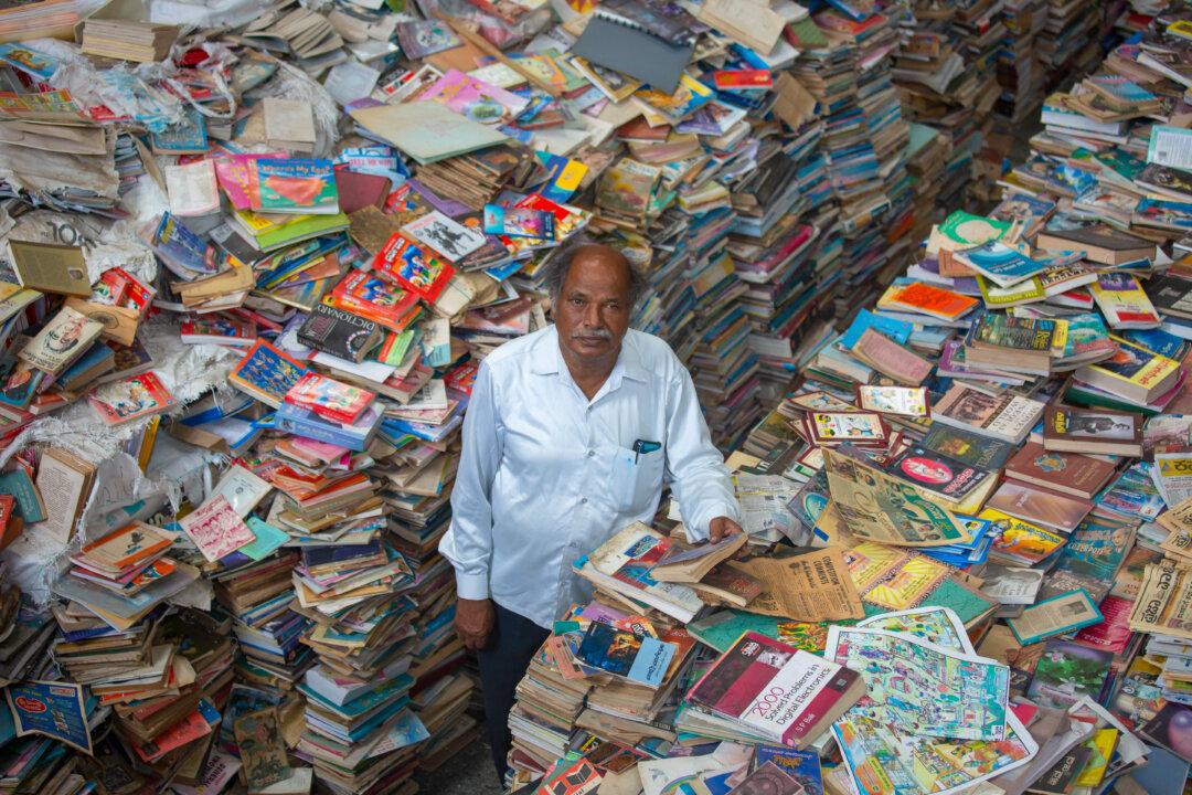 Anke Gowda poses for a photo in the Anke Gowda Jnana Prathistana (Knowledge Shrine) in Kennalu village, India, on Aug. 5, 2025. The shrine, founded and managed by 76-year-old Gowda, a former sugar factory worker with no formal training in library science, is home to one of the world’s largest private book collections. (Abhishek Chinnappa/Getty Images)