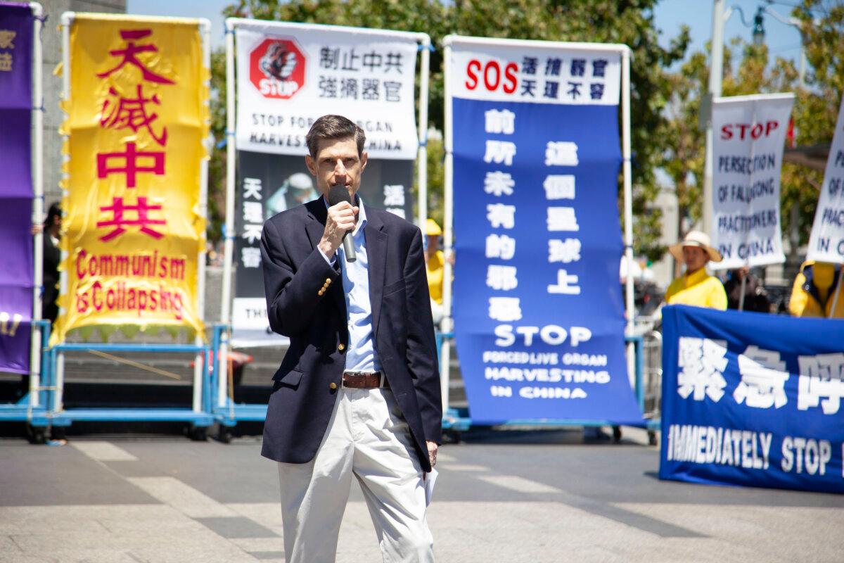 DAFOH Vice Medical Director Ali Centurion speaks at the rally in San Francisco on Aug. 2. (Lear Zhou/The Epoch Times)