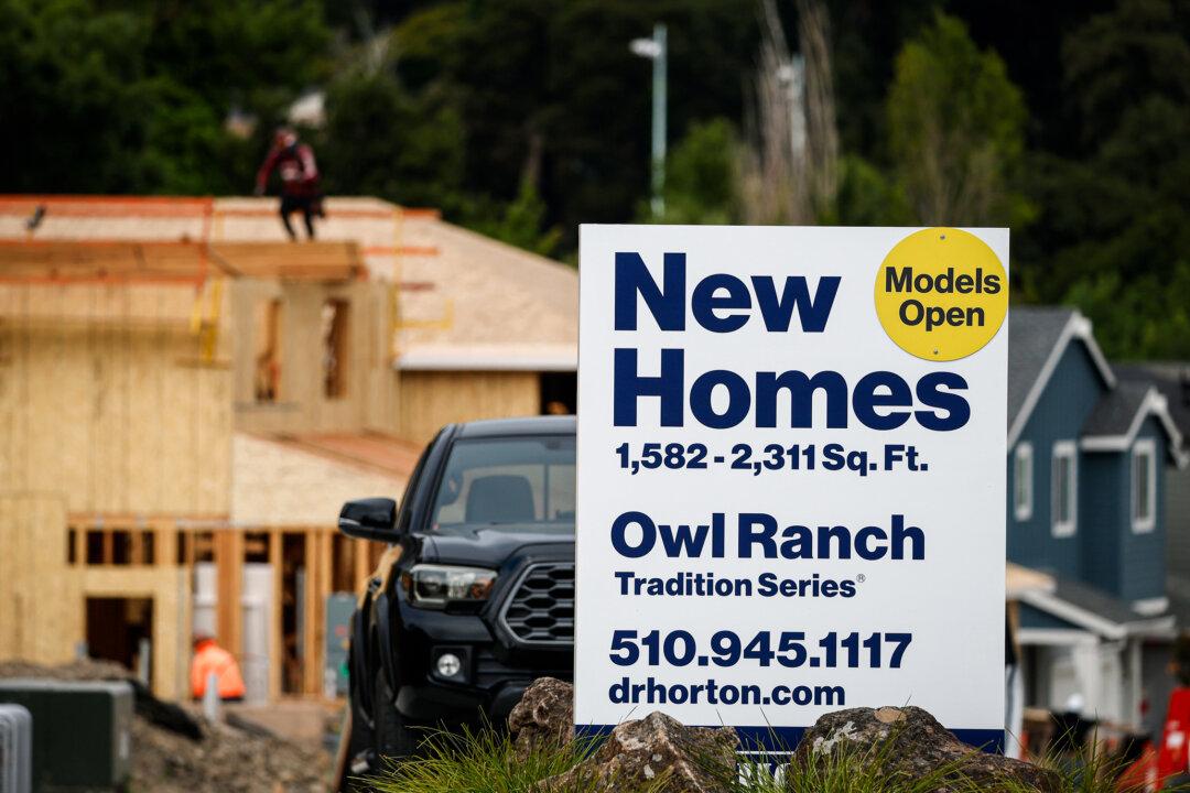 A sign advertises homes in front of a new housing development in Hercules, Calif., on July 1, 2025. In recent years, sociological critique of conventional, low-density zoning in urban and suburban areas has gained traction. (Justin Sullivan/Getty Images)