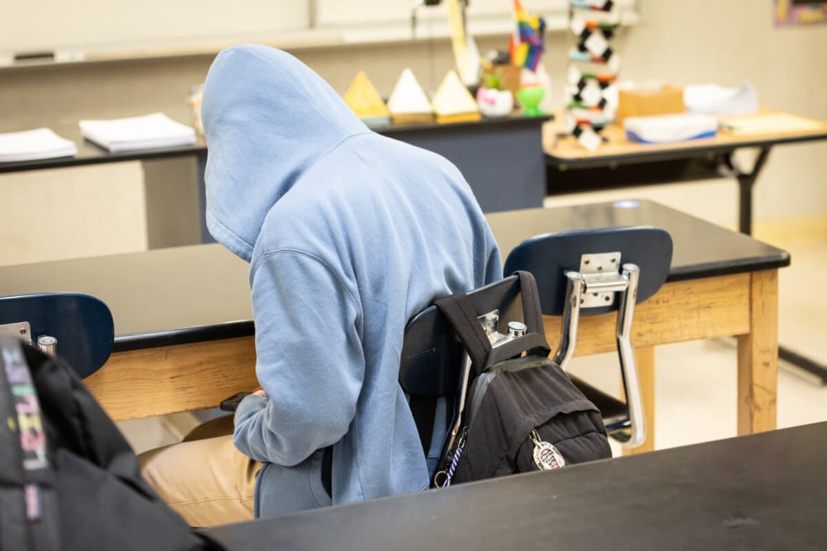 A student in the Los Angeles Unified School District uses his phone in Los Angeles on Jan. 8, 2024. (John Fredricks/The Epoch Times)