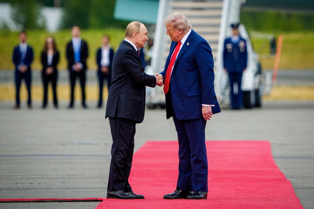 U.S. President Donald Trump (R) greets Russian President Vladimir Putin as he arrives at Joint Base Elmendorf-Richardson in Anchorage, Alaska, on Aug. 15, 2025. The two leaders are meeting for peace talks aimed at ending the Russia–Ukraine war. (Andrew Harnik/Getty Images)