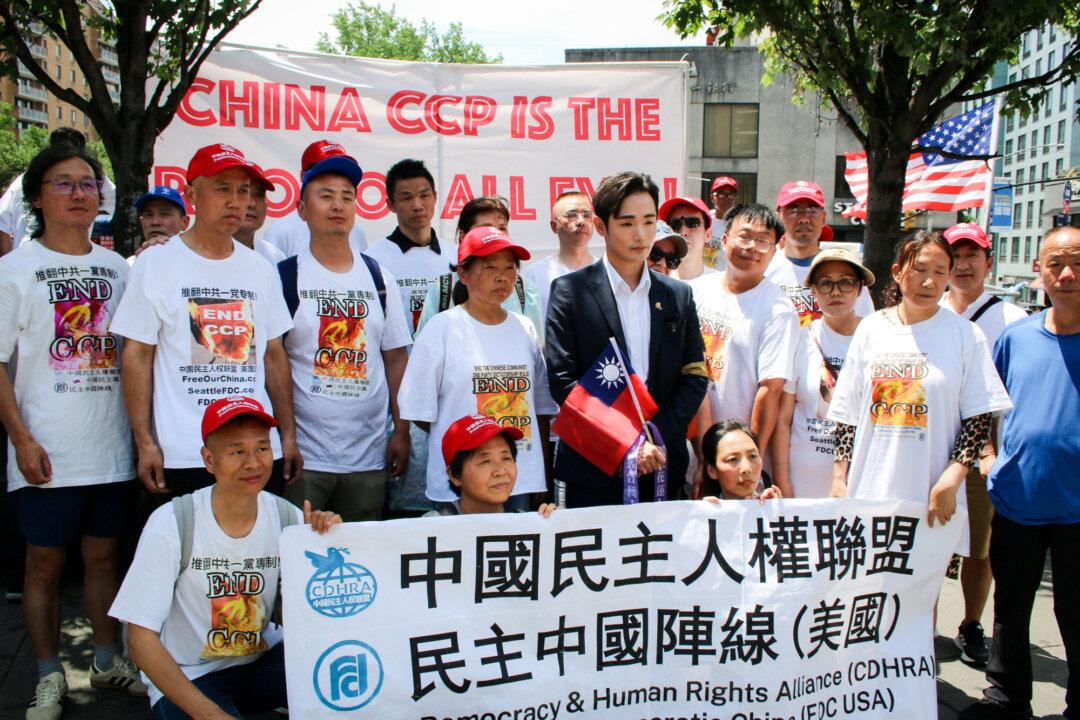 Wen Tzu-yu, a Taiwanese YouTuber known as Pa Chiung, participates in an anti-Chinese Communist Party rally in the Flushing neighborhood of Queens in New York City on June 29, 2025. Wen called Taiwan “the territory that the CCP most vies for” in a recent interview with The Epoch Times. (Edwin Huang/The Epoch Times)
