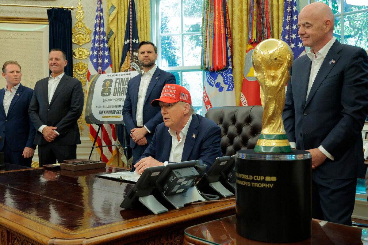 President Donald Trump speaks in the Oval Office while FIFA President Gianni Infantino (R), and Vice President JD Vance (3rd L) look on Aug. 22, 2025. (Chip Somodevilla/Getty Images)