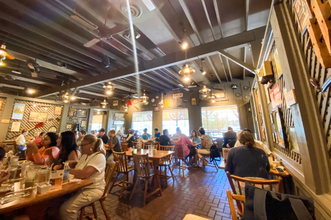 Customers enjoy food at the Cracker Barrel Old Country Store in Mount Arlington, N.J., on Aug. 22, 2025. Cracker Barrel has a special place in the hearts of many Americans, offering country cuisine in a folksy setting with rocking chairs and occasional country music performances. (Gregory Walton/AFP via Getty Images)