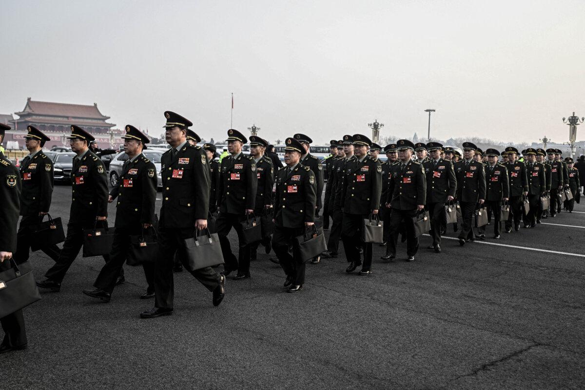 Military delegates arrive for the opening session of the National People's Congress (NPC) at the Great Hall of the People in Beijing on March 5, 2025. (Wang Zhao/AFP via Getty Images)