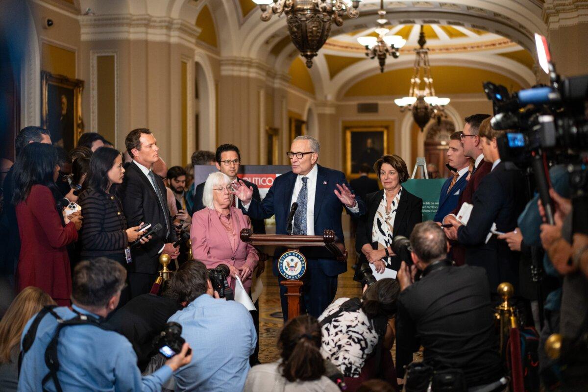 Senate Minority Leader Chuck Schumer (D-N.Y.), joined by other Senate Democrats, speaks to reporters as the government is on verge of shutdown amid partisan standoff, on Capitol Hill in Washington on Sept. 30, 2025.(Madalina Kilroy/The Epoch Times)
