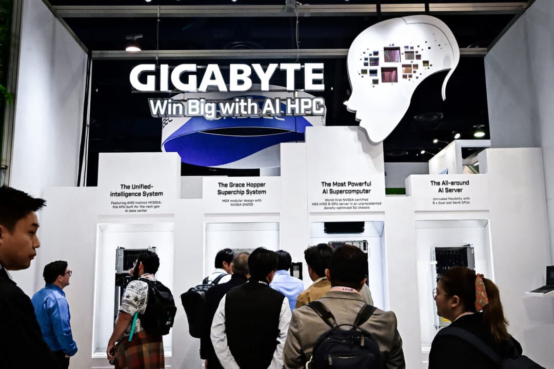 People look at samples of Gigabyte AI supercomputers at the Consumer Electronics Show in Las Vegas on Jan. 9, 2024. Medical experts who study the mind are growing increasingly worried about the long-term ethical impact of users turning to generative AI chatbots for companionship. (Frederic J. Brown/AFP via Getty Images)