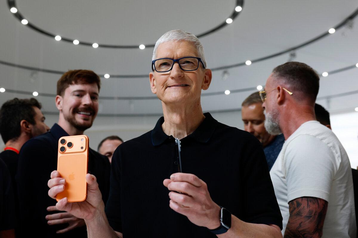 Apple CEO Tim Cook holds an iPhone 17 Pro during an Apple special event at Apple headquarters in Cupertino, Calif., on Sept. 9, 2025. (Justin Sullivan/Getty Images)