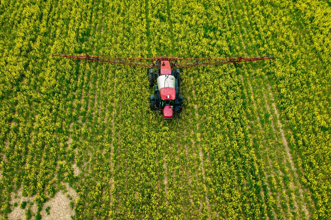 A farmer spreads pesticide on a field in Centreville, Md., on April 25, 2022. Critics said the MAHA report doesn't do enough to reduce the use of pesticides and other chemicals in food production. (Jim Watson/AFP via Getty Images)