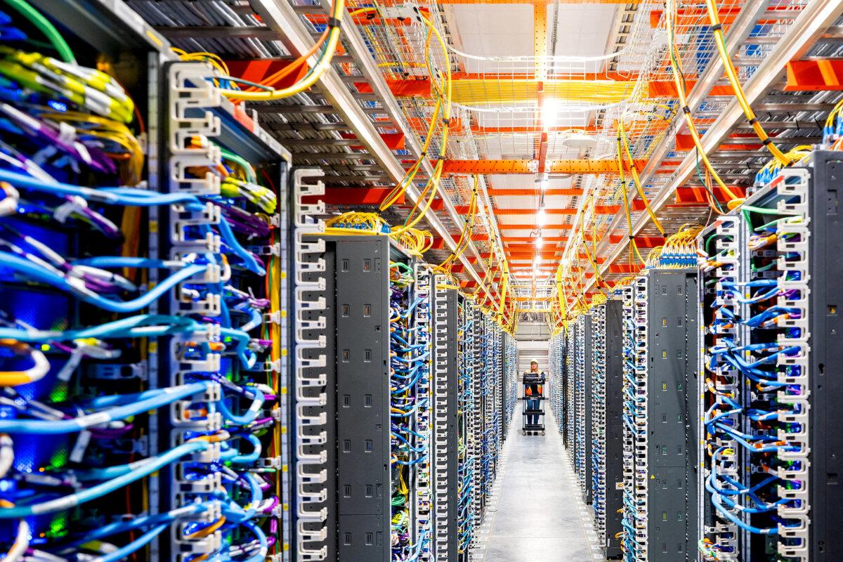 A technician works at an Amazon Web Services AI data center in New Carlisle, Ind., on Oct. 2, 2025. (Noah Berger for AWS/Reuters)