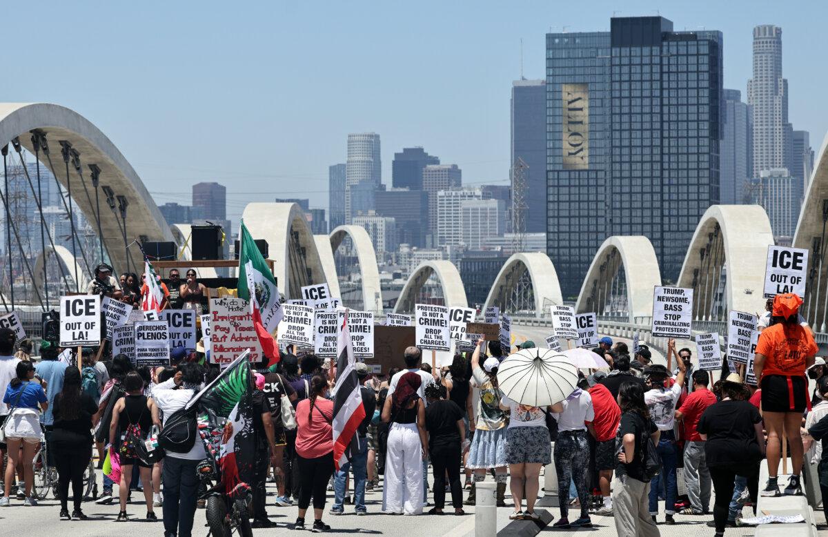 Protesters demonstrate against ICE operations while blocking the Sixth Street Bridge between Boyle Heights and the downtown area of Los Angeles, on July 1, 2025. (Mario Tama/Getty Images)