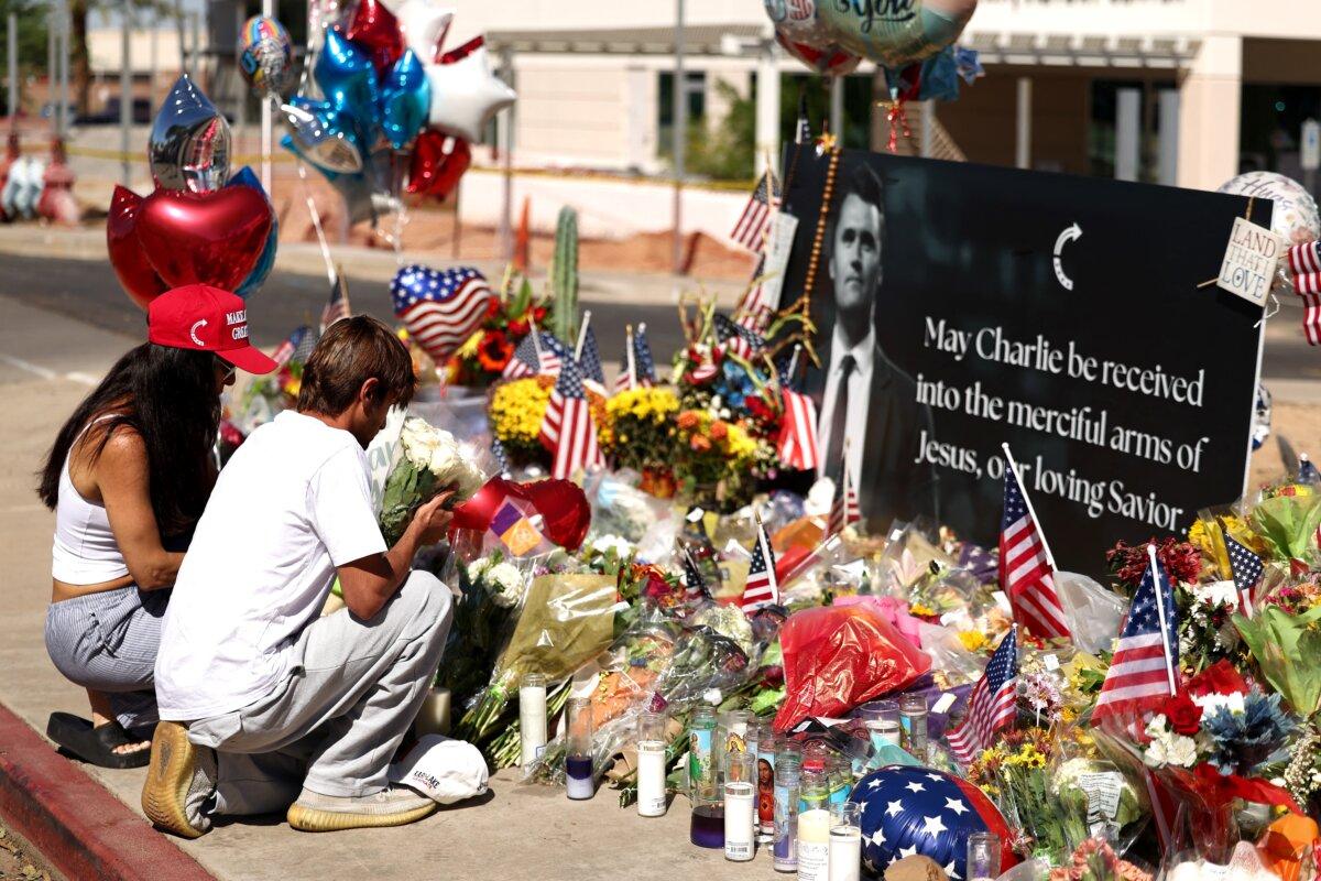 Arizonans mourn Turning Point USA founder Charlie Kirk outside of the Turning Point USA headquarters in Phoenix on Sept. 12, 2025. (Charly Triballeau/AFP)