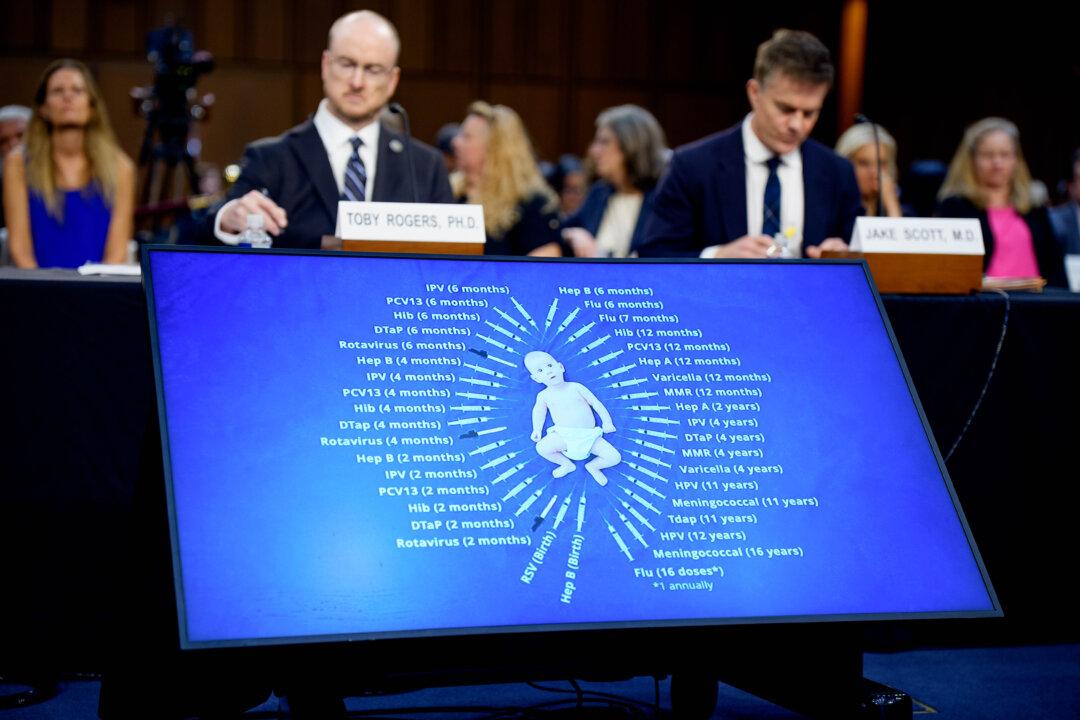 A monitor shows a child surrounded by a list of vaccines during a video played at a Senate Homeland Security and Governmental Affairs subcommittee hearing at the U.S. Capitol in Washington on Sept. 9, 2025. (Andrew Harnik/Getty Images)