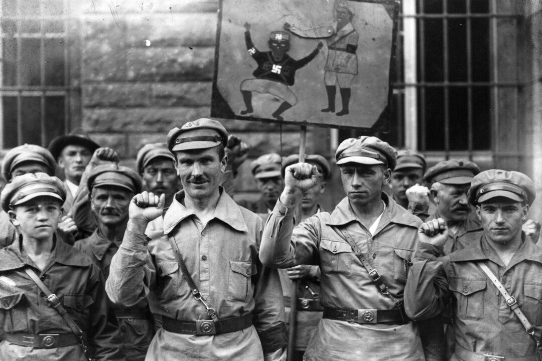 Members of the far left Antifa extremist organization give a clenched-fist salute on Sept. 1, 1928. The group's original intent was to bring about a communist dictatorship in Germany. (Fox Photos/Getty Images)