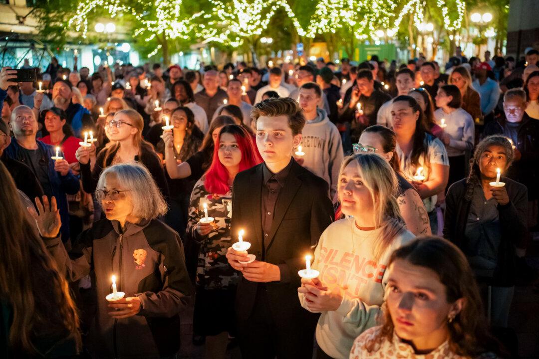 Attendees hold candles during a candlelight vigil and prayer event for Turning Point USA founder Charlie Kirk in Seattle on Sept. 10, 2025. Kirk was assassinated while speaking at a Turning Point event at Utah Valley University earlier in the day. (David Ryder/Getty Images)