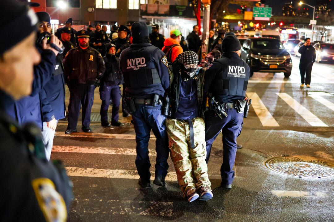 New York police arrest a protester during a pro-transgender demonstration in New York City on Feb. 3, 2025. President Donald Trump recently said his administration is examining possible transgender extremism in the country. (Charly Triballeau/AFP via Getty Images)
