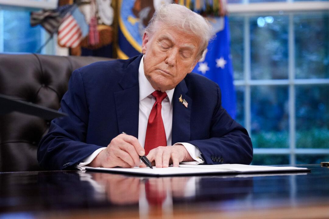 President Donald Trump signs an executive order in the Oval Office on Sept. 25, 2025. Days earlier, the president designated Antifa a domestic terrorist group and later signed a memorandum to dismantle left-wing terrorism networks in the United States. (Andrew Harnik/Getty Images)