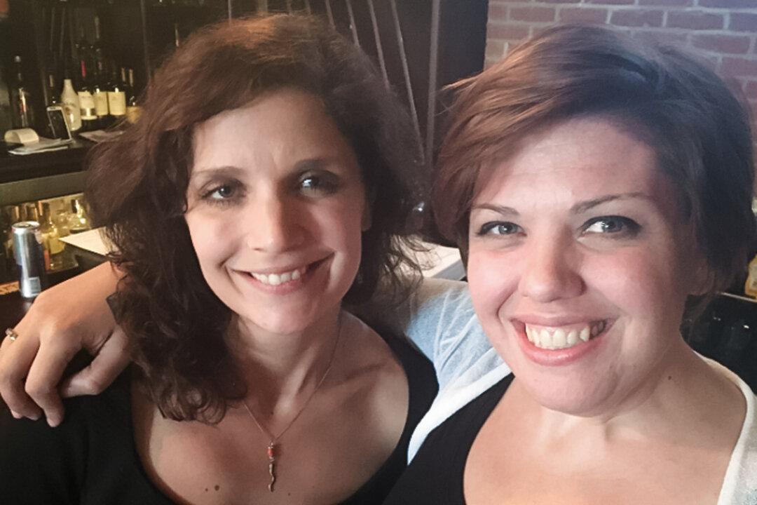 Multiple sclerosis patient Sarah (R) poses with her sister, in this file photo. (Courtesy of Sarah)