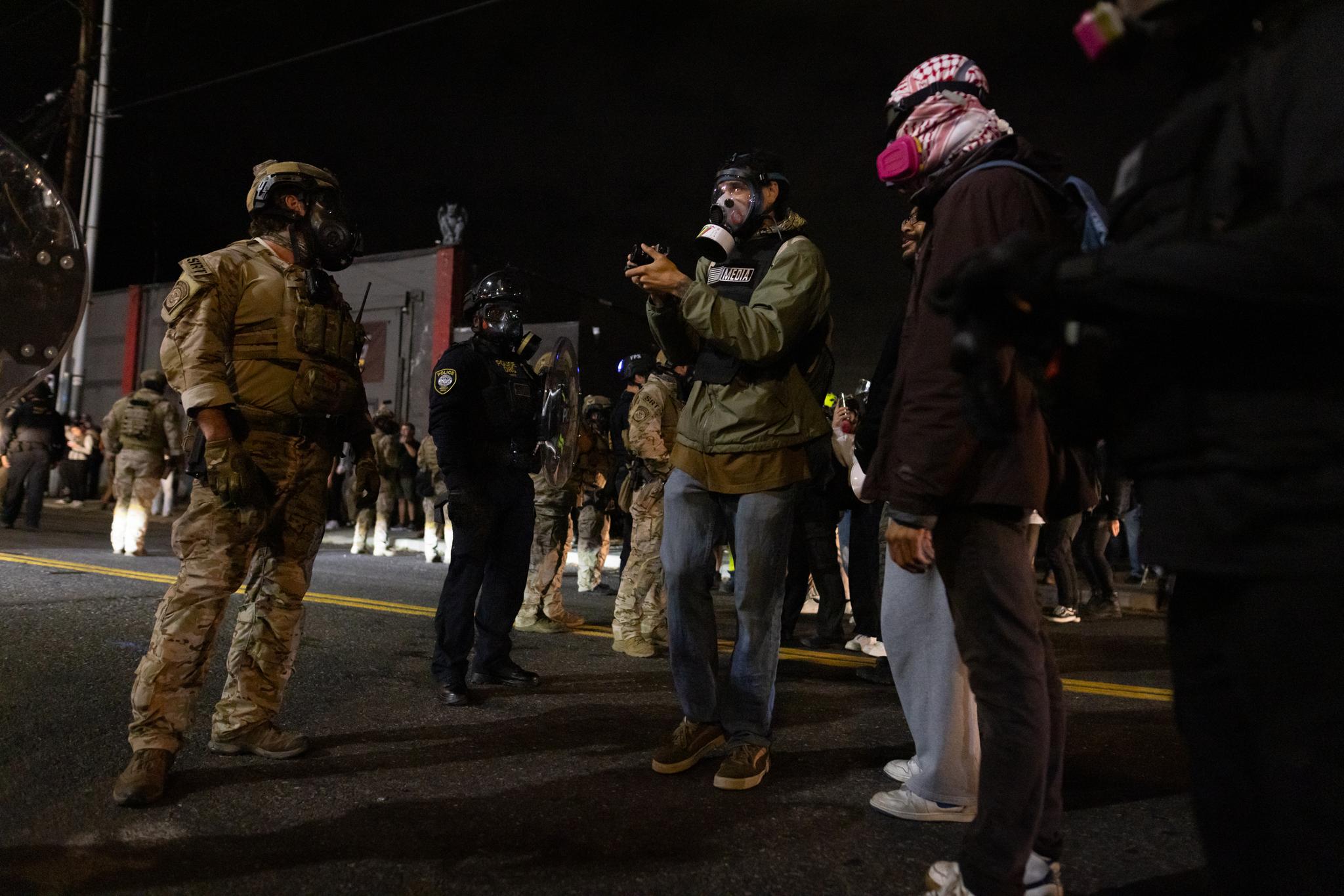 Protesters taunt federal agents in front of Immigration and Customs Enforcement offices in Portland, Ore., on Oct. 3, 2025. (John Fredricks/The Epoch Times)