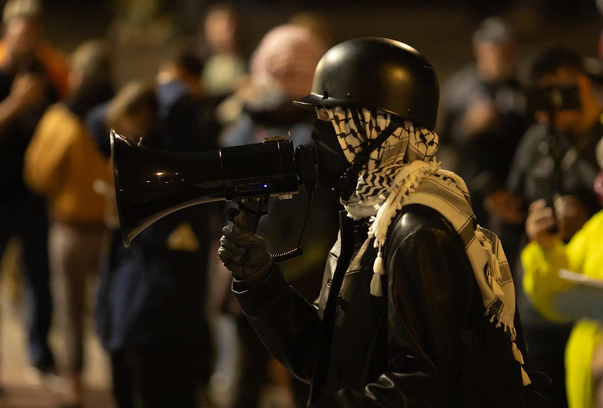 Protesters taunt federal agents in front of Immigration and Customs Enforcement offices in Portland, Ore., on Oct. 3, 2025. (John Fredricks/The Epoch Times)