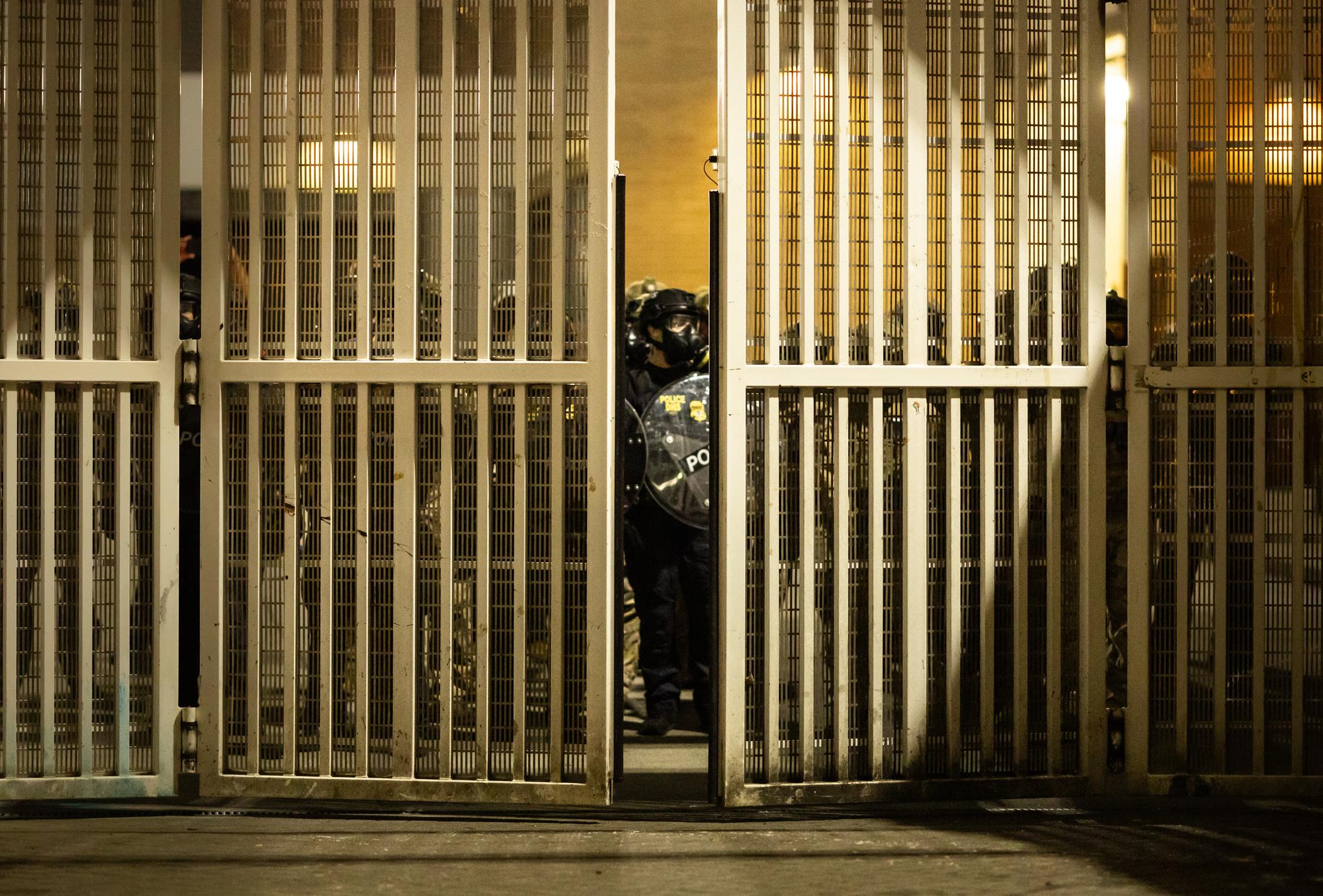 Federal agents move back into the compound of Immigration and Customs Enforcement offices in Portland, Ore., on Oct. 3, 2025. (John Fredricks/The Epoch Times)