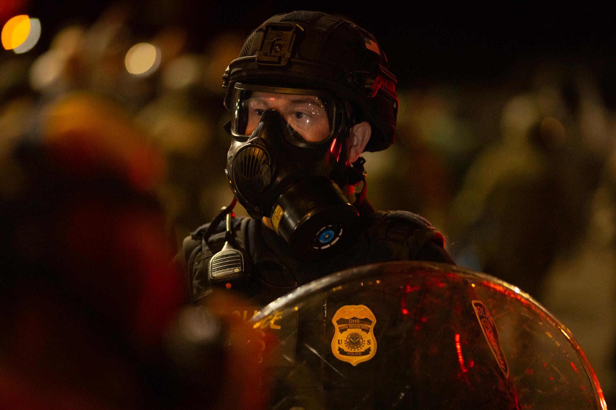 Federal agents in front of Immigration and Customs Enforcement offices in Portland, Ore., on Oct. 3, 2025. (John Fredricks/The Epoch Times)