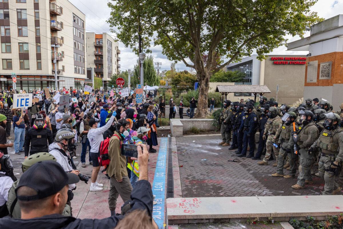 Protesters move toward ICE offices in Portland, Ore., on Oct. 4, 2025. (John Fredricks/The Epoch Times)