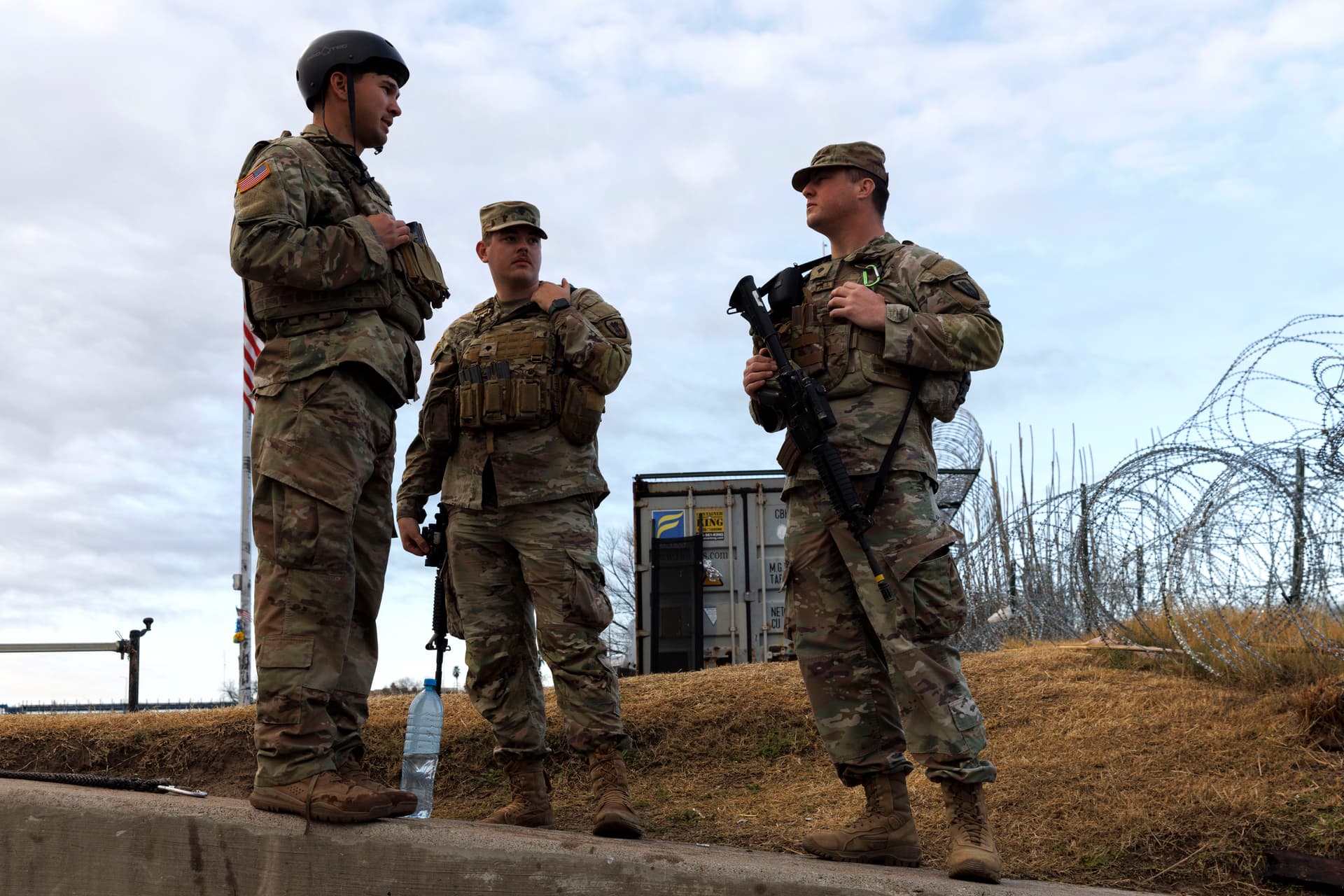 Texas National Guard soldiers wait nearby the boat ramp where law enforcement enter the Rio Grande at Shelby Park in Eagle Pass, Texas, on Jan. 26, 2024. (Michael Gonzalez/Getty Images)
