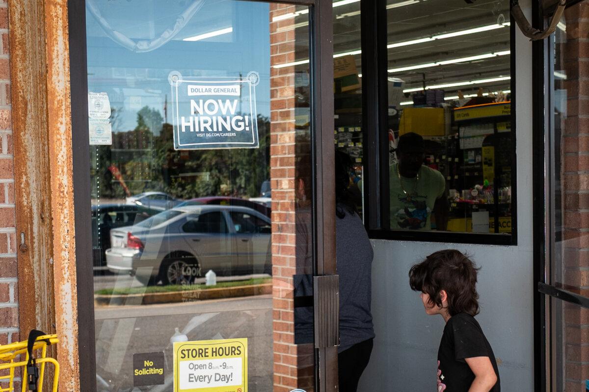 A "Now Hiring" sign at a store in Norfolk, Va., on Oct. 5, 2025. (Madalina Kilroy/The Epoch Times)