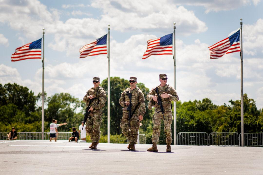 National Guard members patrol the National Mall in Washington on Aug. 27, 2025. (Madalina Kilroy/The Epoch Times)