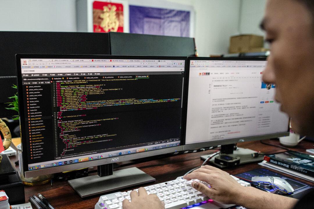 Prince, a member of the hacking group Red Hacker Alliance who refused to give his real name, uses his computer at an office in Dongguan, Guangdong Province, China, on Aug. 4, 2020. (Nicolas Asfouri/AFP via Getty Images)