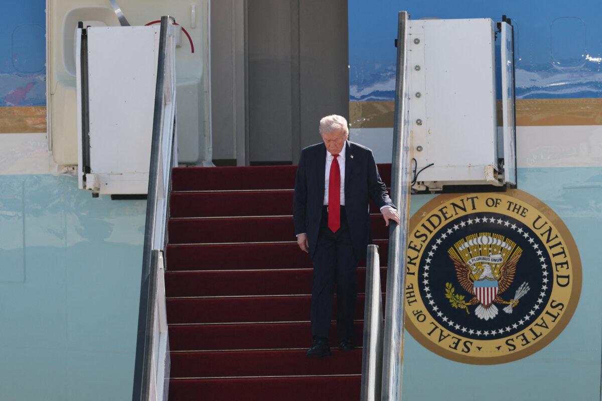 U.S. President Donald Trump disembarks from Air Force One upon arrival at Ben Gurion Airport on the outskirts of Lod near Tel Aviv, Israel, on Oct. 13, 2025. (Jack Guez/AFP via Getty Images)