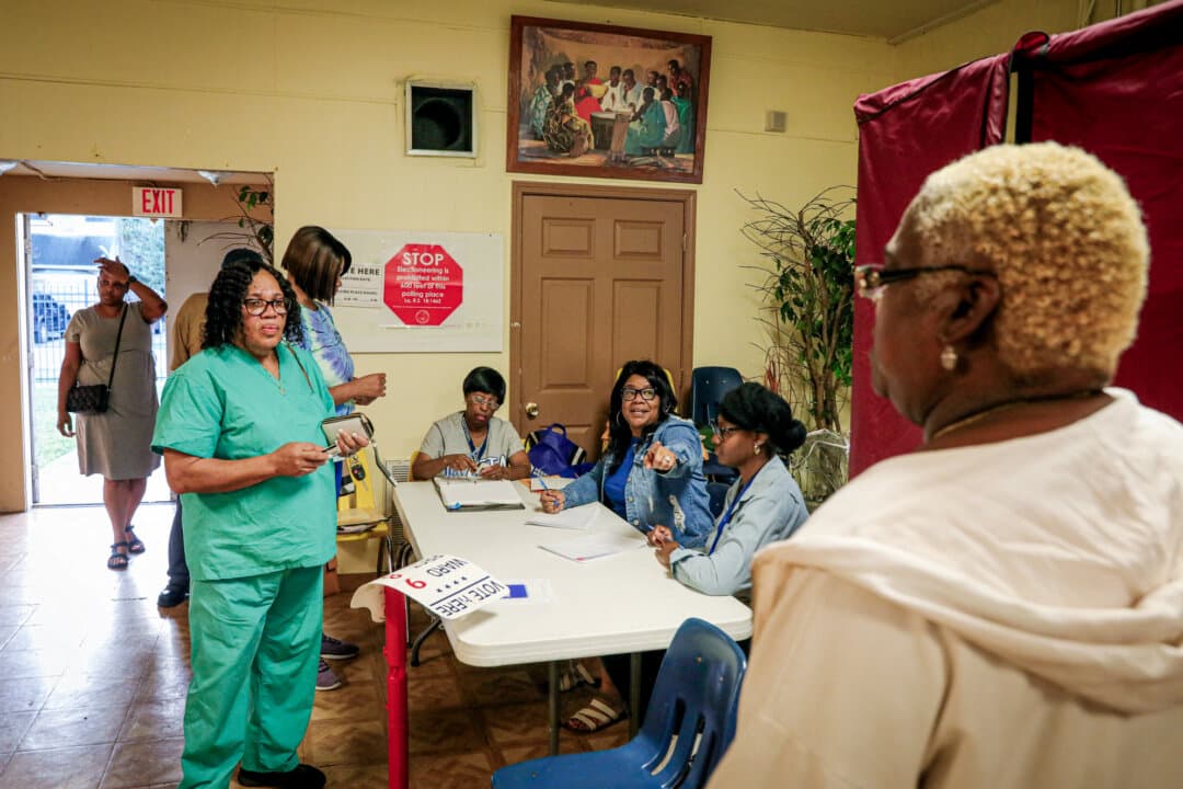 Voters cast ballots at St. David’s Baptist Church in the 9th Ward of New Orleans, La., on Nov. 5, 2024. Louisiana now requires a Social Security number or ID number to change a name on voter rolls after marriage. (Sandy Huffaker/AFP via Getty Images)