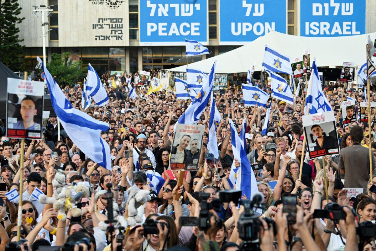 People gather to watch the hostage release live stream at Hostages Square in Tel Aviv, Israel, on Oct. 13, 2025. (Alexi J. Rosenfeld/Getty Images)