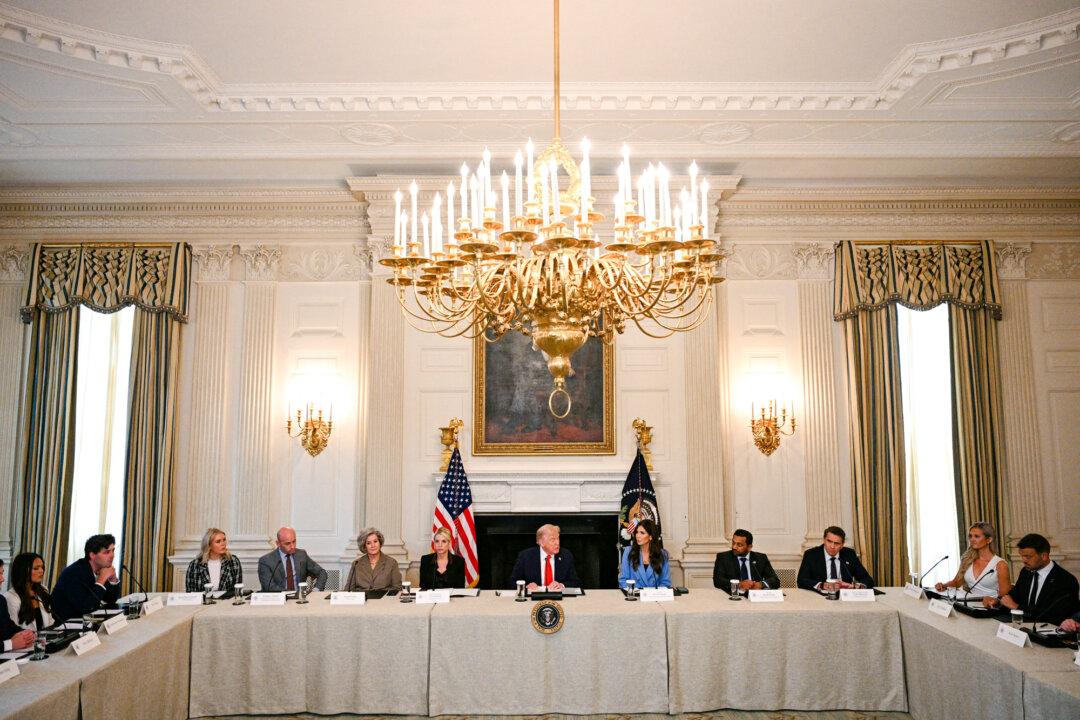 President Donald Trump (C) chairs a roundtable on Antifa in the State Dining Room of the White House on Oct. 8, 2025. On Sept. 22, he designated Antifa a “domestic terrorist organization” and ordered agencies to root out illegal operations tied to the group. (Jim Watson/AFP via Getty Images)