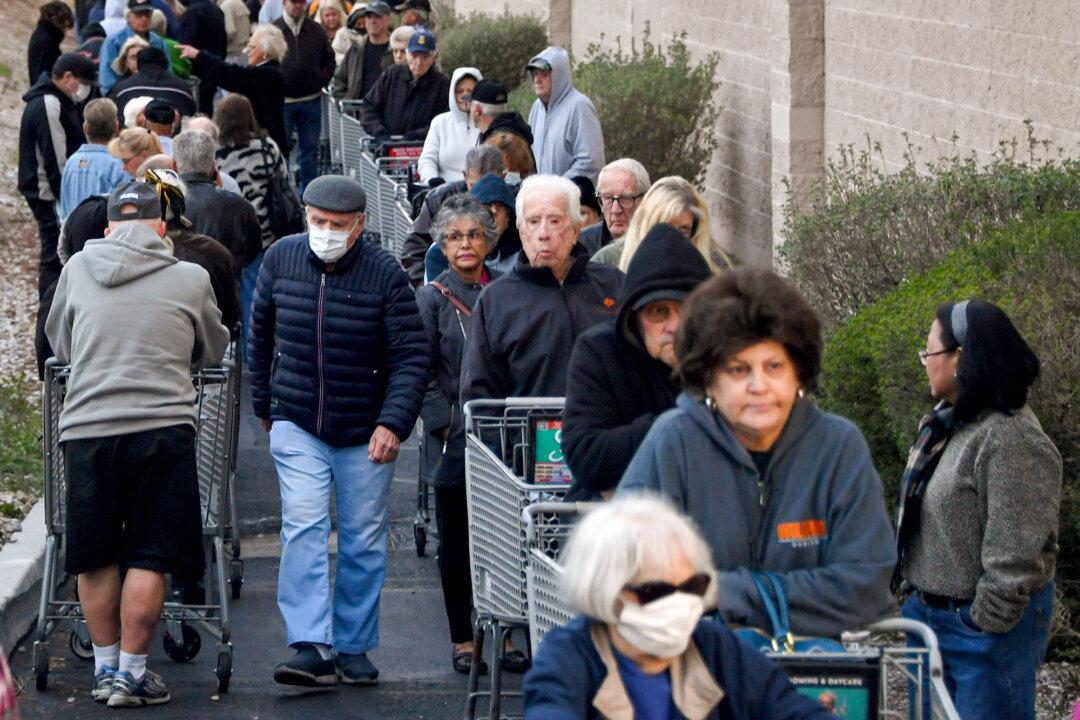 Senior shoppers wait in line for a store to open in Las Vegas on March 20, 2020. The number of U.S. adults older than age 55 is estimated to be near 103 million, according to the Federal Reserve Bank of St. Louis. (Ethan Miller/Getty Images)