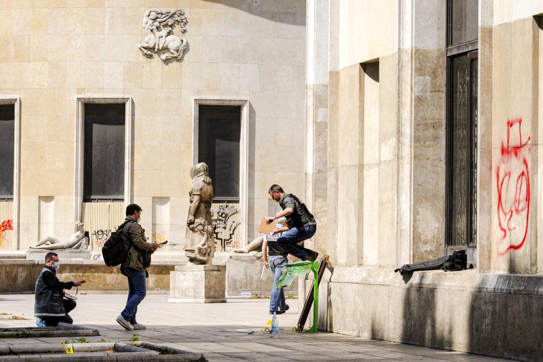 Police officers investigate at the Paris' Musee d'Art Moderne, where five works including paintings by Henri Matisse and Pablo Picasso have been stolen, on May 20, 2010. The pieces were never recovered. (Bertrand Guay/AFP via Getty Images)