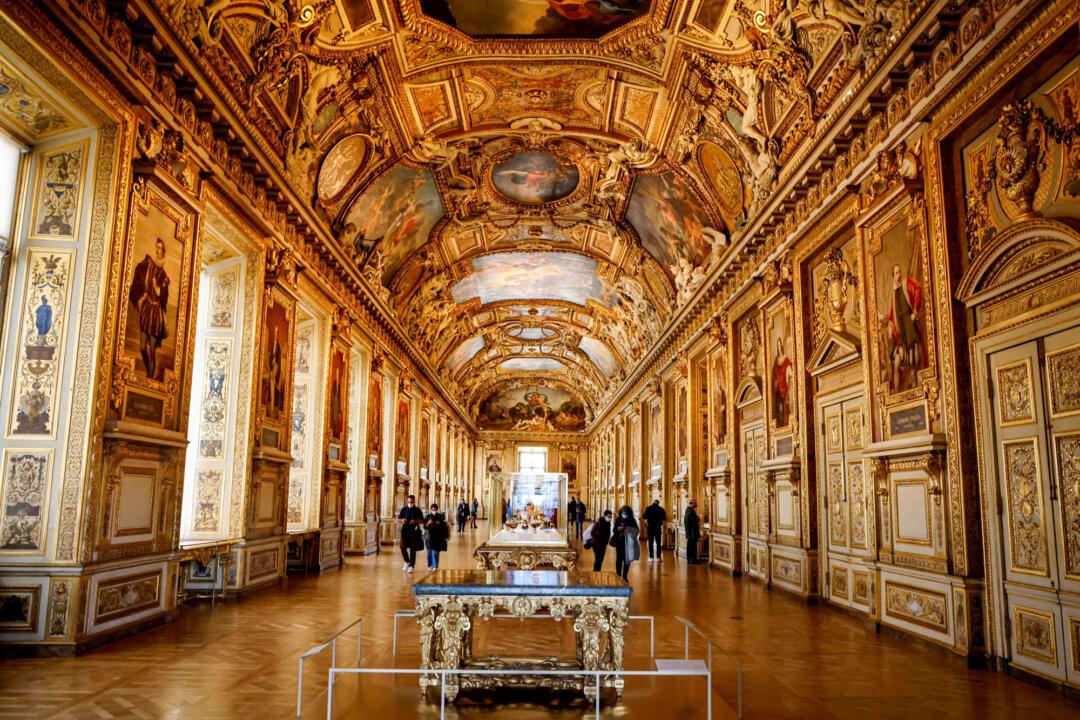 People visit the Galerie d'Apollon at the Louvre in Paris on Oct. 14, 2020. The famous Parisian museum has been targeted by thieves many times in history. (Ludovic Marin/AFP via Getty Images)