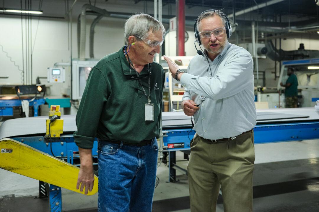 Edwin Underwood (R), president and COO of Marsh Cabinets, a family-owned manufacturer of American-made cabinetry, and Plant Manager Ken Kuhn in High Point, N.C., on Oct. 10, 2025. Despite new tariffs intended to level the playing field, Underwood is concerned that foreign companies will continue to undercut domestic producers through price manipulation. (The Epoch Times)
