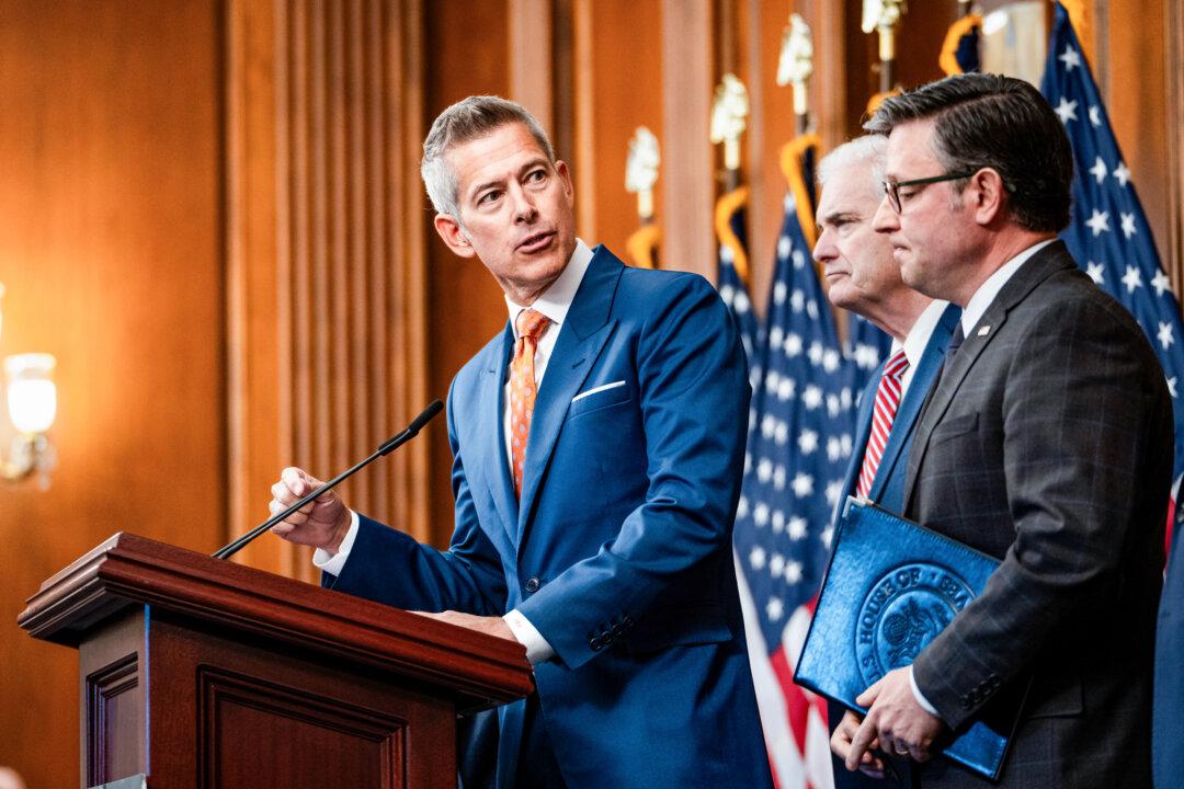 Transportation Secretary Sean Duffy, joined by House Speaker Mike Johnson (R-La.) and other House Republicans, speaks at a press conference during the government shutdown in Washington on Oct. 23, 2025. On Sept. 26, Duffy announced emergency rules that will make it more difficult for about 200,000 nonresident drivers to obtain commercial learner’s permits and commercial driver’s licenses. (Madalina Kilroy/The Epoch Times)