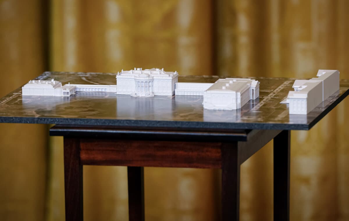 A model of the White House and proposed ballroom (R) is displayed during a ballroom fundraising dinner with President Donald Trump in the East Room of the White House on Oct. 15, 2025. (Kevin Dietsch/Getty Images)