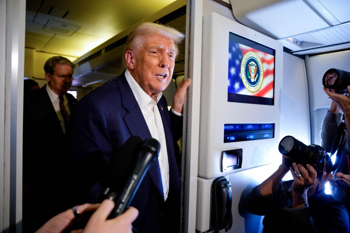 U.S. President Donald Trump speaks to members of the media aboard Air Force One on Oct. 27, 2025. (Andrew Harnik/Getty Images)