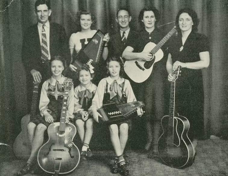 The Carter Family in Texas, 1940. Standing, from left: A. P. Carter, Janette Carter, Brother Bill Carter, Sara Carter, and Maybelle Carter. Seated from left: Helen Carter, Anita Carter, and June Carter. (Country Music Hall of Fame and Museum)