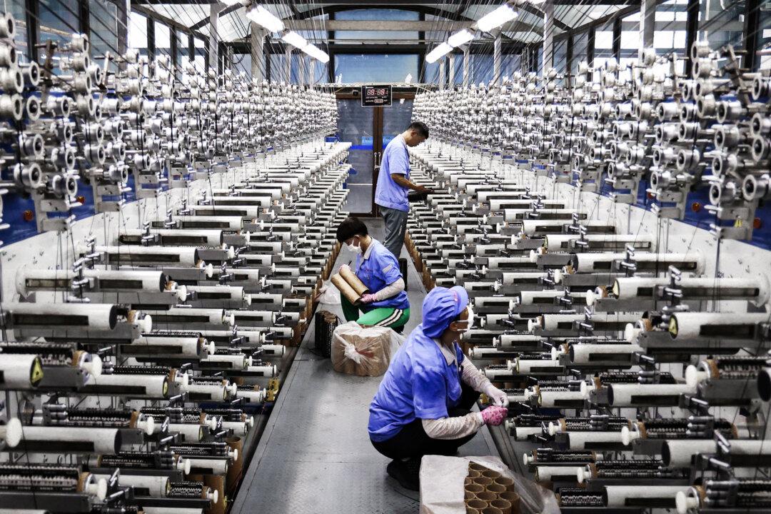Employees work on a carbon fiber production line in Lianyungang, Jiangsu Province, China, on July 31, 2025. A key goal of the Chinese Communist Party is to achieve technological self-sufficiency. (STR/AFP via Getty Images)