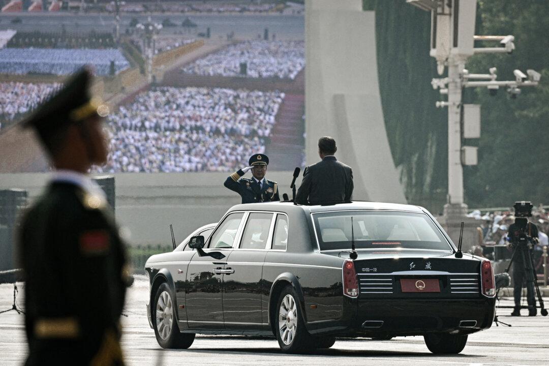 Chinese leader Xi Jinping (R) receives a military salute before inspecting the troops during a military parade marking the 80th anniversary of victory over Japan and the end of World War II, on Tiananmen Square in Beijing on Sept. 3, 2025. (Greg Baker/AFP via Getty Images)