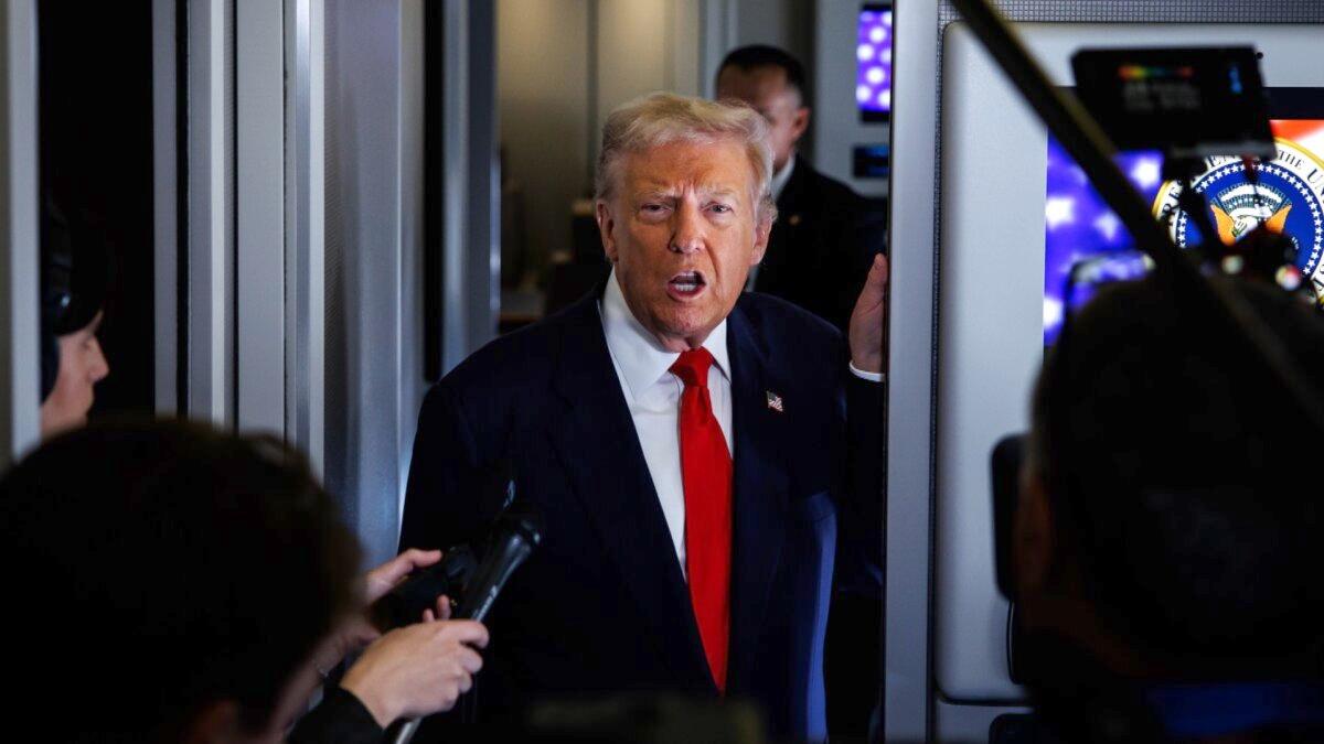 U.S. President Donald Trump speaks to members of the media on board Air Force One at Joint Base Andrews, Md., on Oct. 31, 2025. (Samuel Corum/Getty Images)