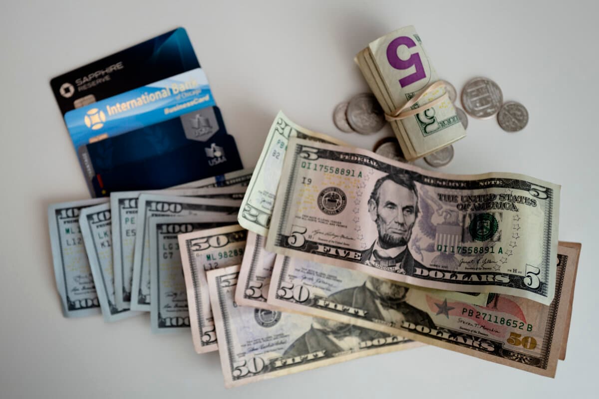 U.S. dollar bills and credit and debit cards in Washington on Oct. 4, 2024. (Madalina Vasiliu/The Epoch Times)