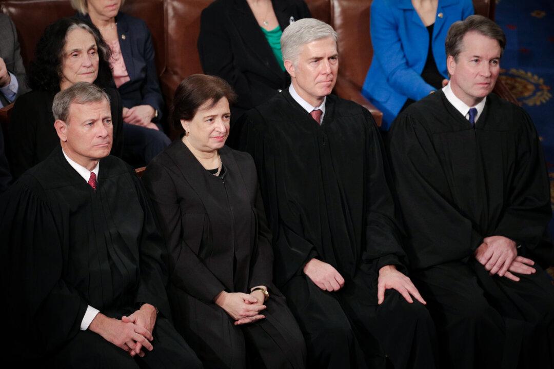 (L–R) Supreme Court Justices John Roberts, Elena Kagan, Neil Gorsuch, and Brett Kavanaugh look on as President Donald Trump delivers the State of the Union address at the U.S. Capitol on Feb. 5, 2019. (Alex Wong/Getty Images)
